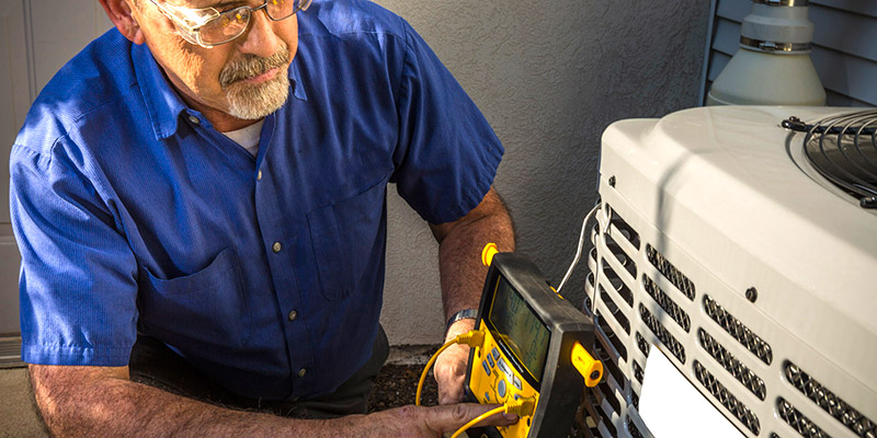 Smart Touch technician working on A/C unit